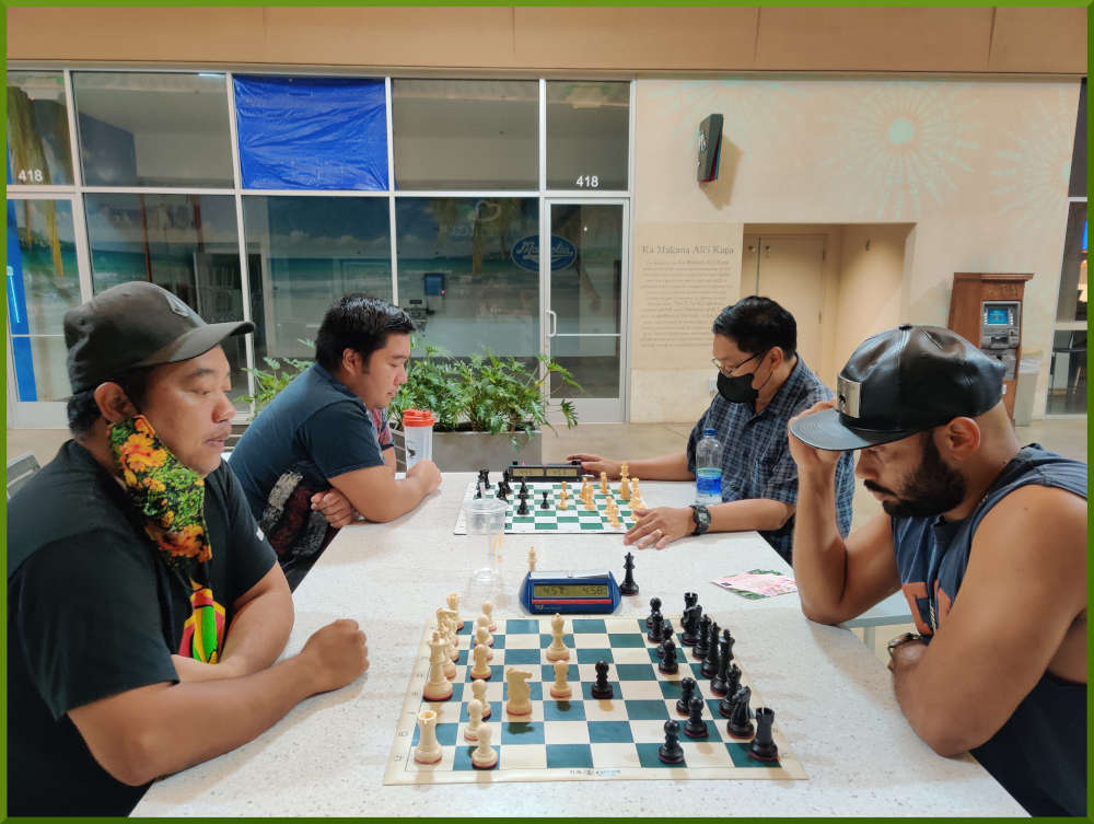 April 26th, 2022. Ka Makana Alii chess meetup. Jeremy vs John (near board). Ceazar vs Jose (far board).