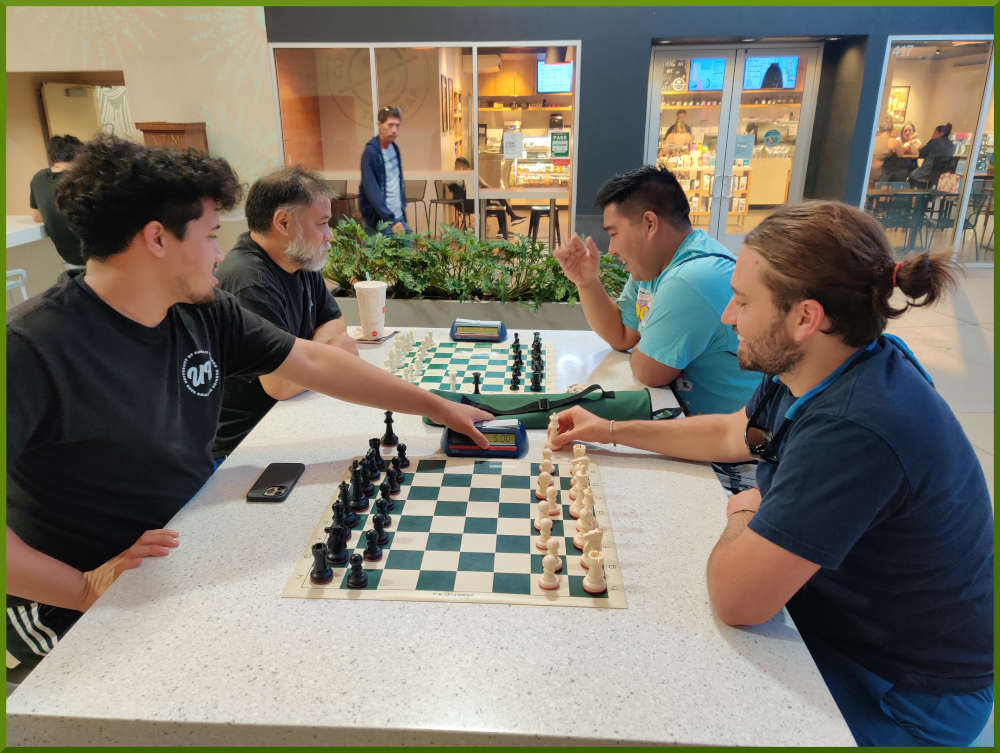 May 3rd, 2022. Ka Makana Alii chess meetup. Christian vs Ari (near board). Chet vs Ceazar (far board).