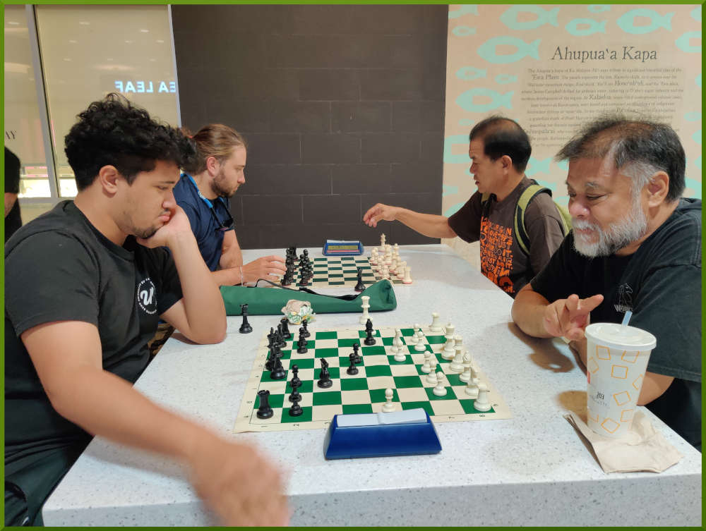 May 3rd, 2022. Ka Makana Alii chess meetup. Christian vs Chet (near board). Ari vs Eddie (far board).