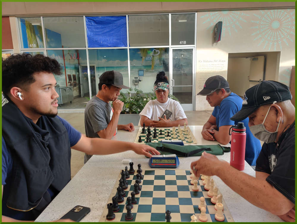 May 17th, 2022. Ka Makana Alii chess meetup. Christian vs Auro (near board). Eddie vs Jimmy (far board).