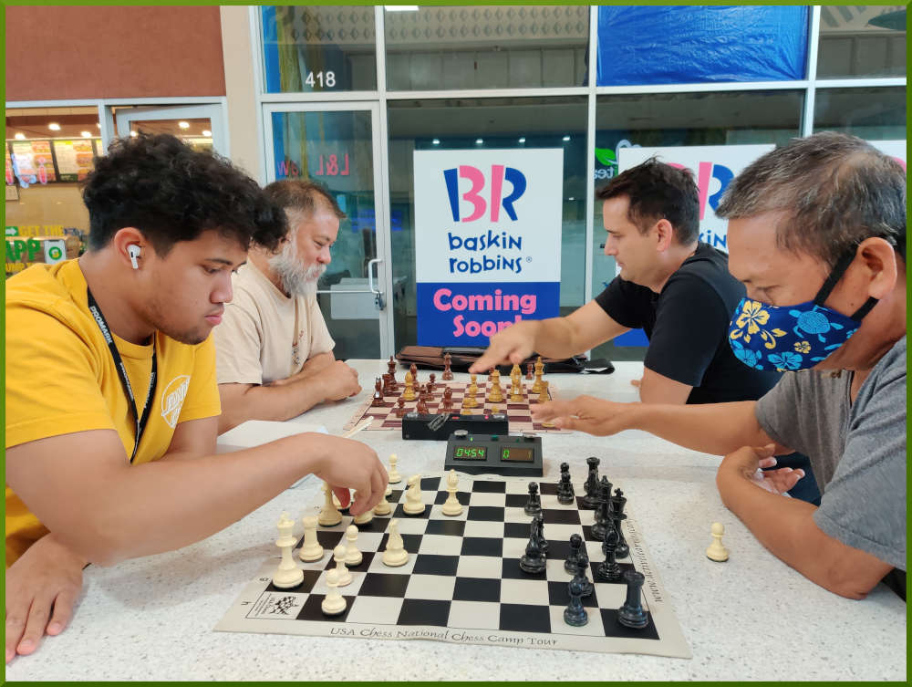 June 7th, 2022. Ka Makana Alii chess meetup. Christian vs Edgar (near board). Chet vs Ryan (far board).