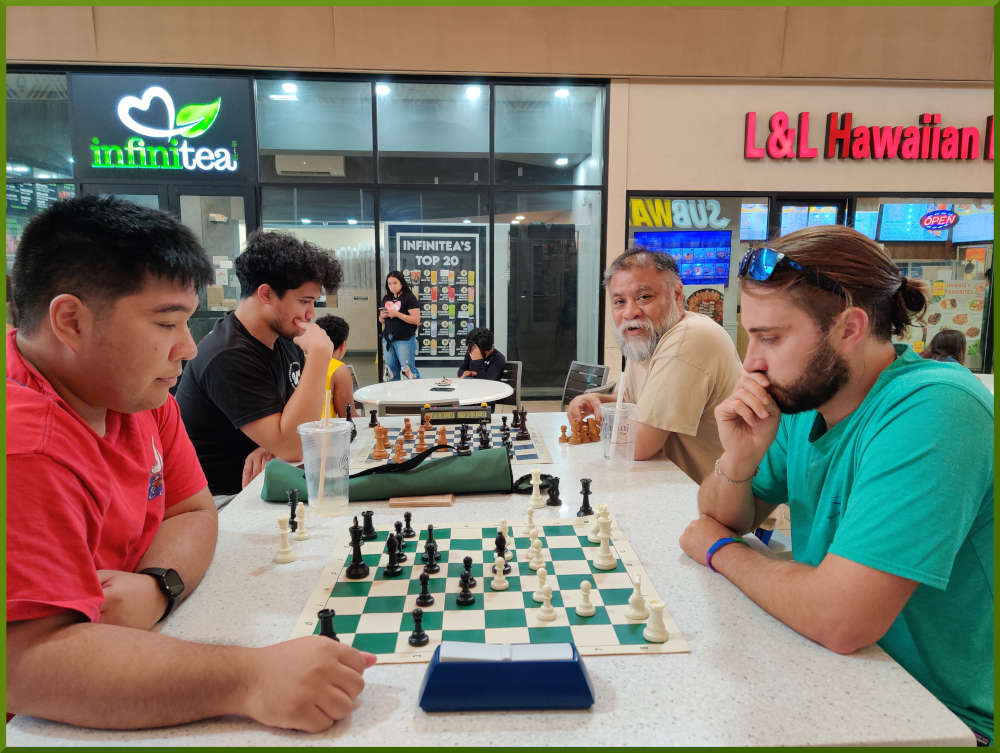 June 21st, 2022. Ka Makana Alii chess meetup. Ceazar vs Ari (near board). Christian vs Chet (far board).