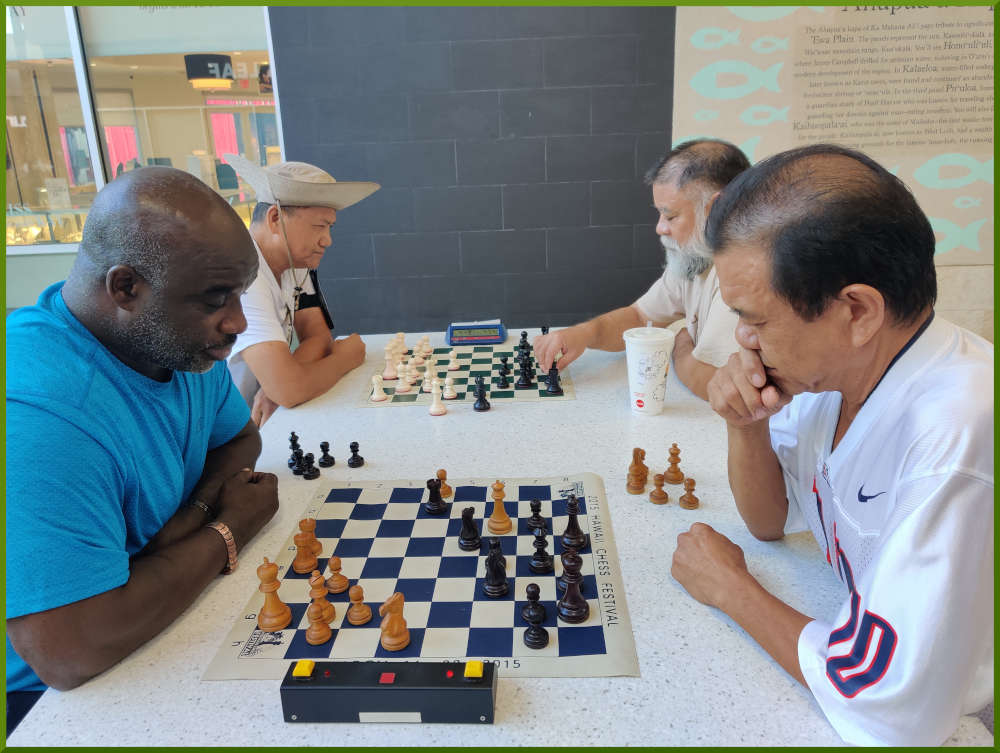 July 19th, 2022. Ka Makana Alii chess meetup. Ramon vs Eddie (near board). Edgar vs Chet (far board).