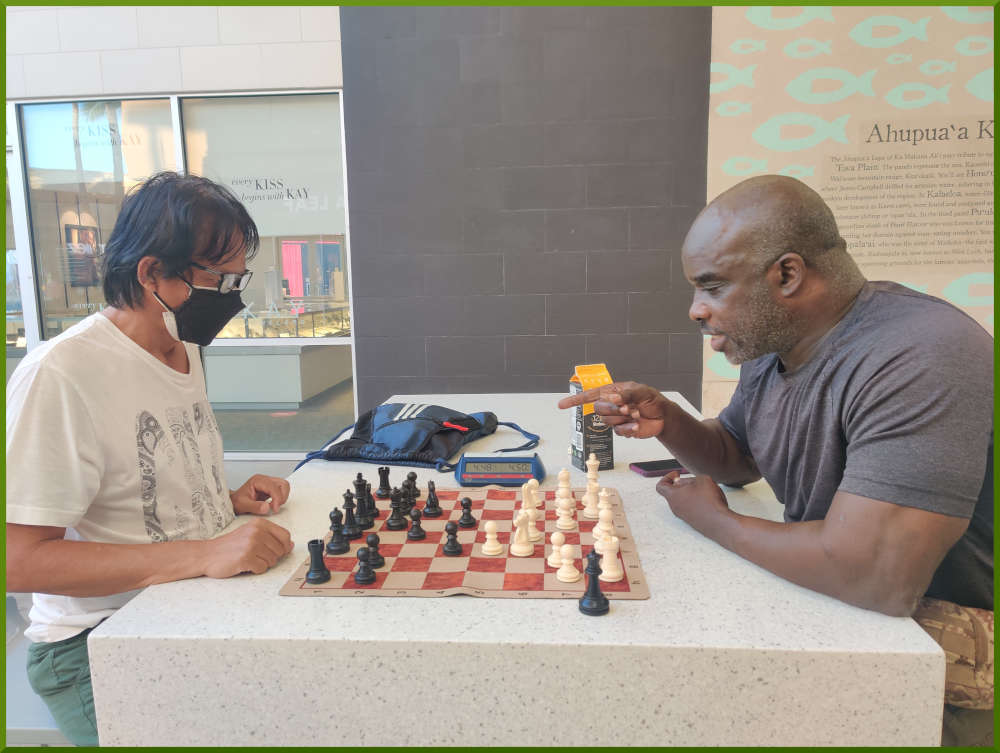 August 2nd, 2022. Ka Makana Alii chess meetup. A closer view of game between Regie and Ramon.