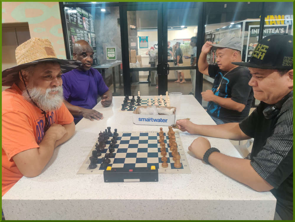 August 9th, 2022. Ka Makana Alii chess meetup. Chet vs Nick (near board). Ramon vs Jeremy (far board).