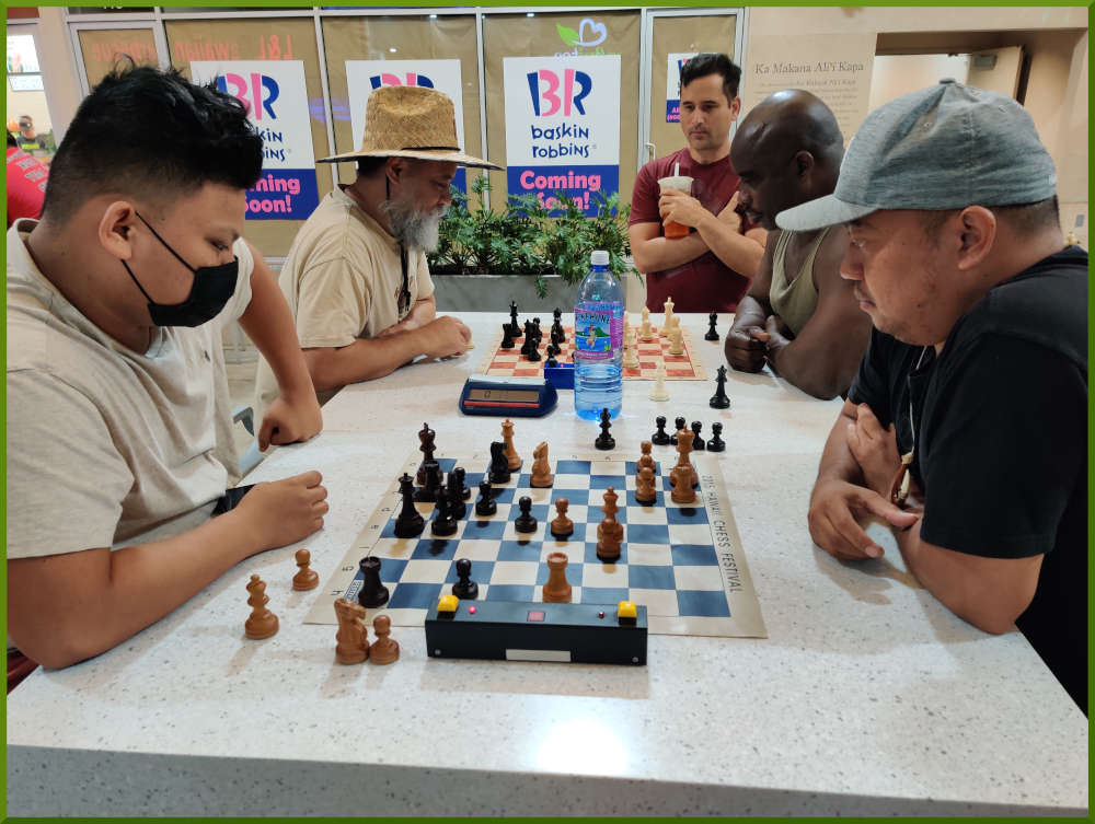 August 16th, 2022. Ka Makana Alii chess meetup. Prince va Jeremy (near board). Chet vs Ramon (far board).