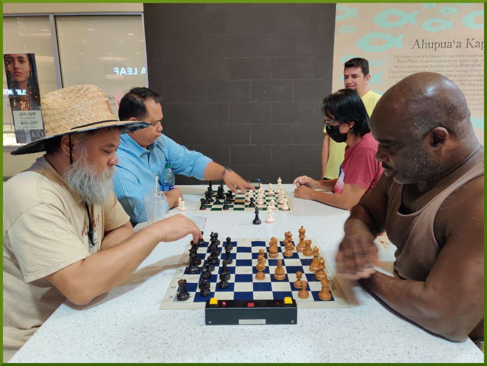 September 13th, 2022. Ka Makana Alii chess meetup. Chet vs Ramon (near board). Richard vs Regie (far board).